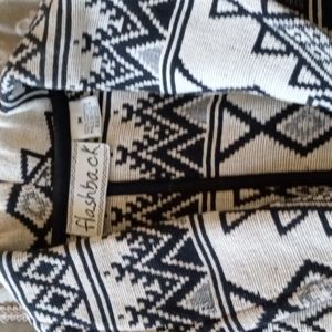 Short bolero type jacket with black print and one button closure. India made.